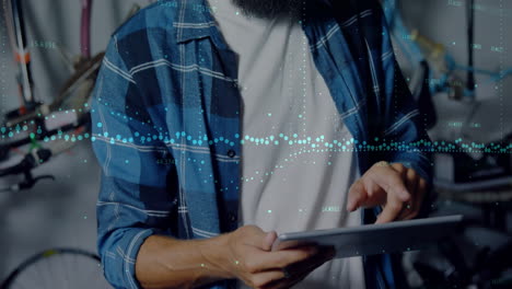 animation of data processing over caucasian man using tablet