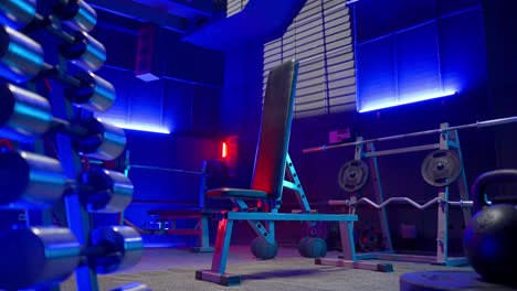 modern home gym with blue lighting