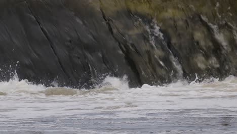 mass of water falling from the weir into the river