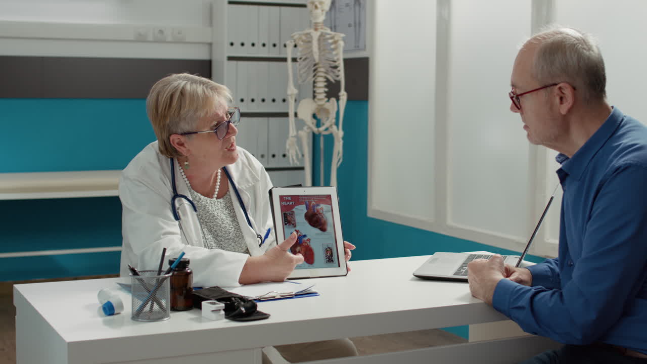 Female physician showing cardiology diagnosis on digital tablet