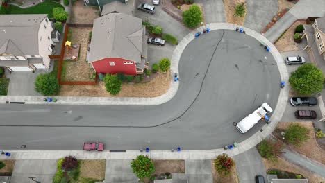 Overhead-static-shot-of-a-garbage-truck-picking