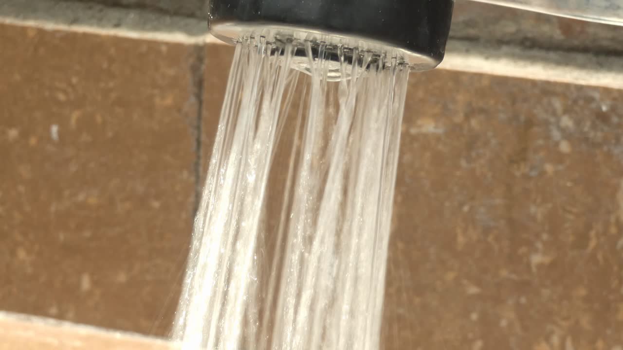 Close-up of Water Flowing from a Shower Head