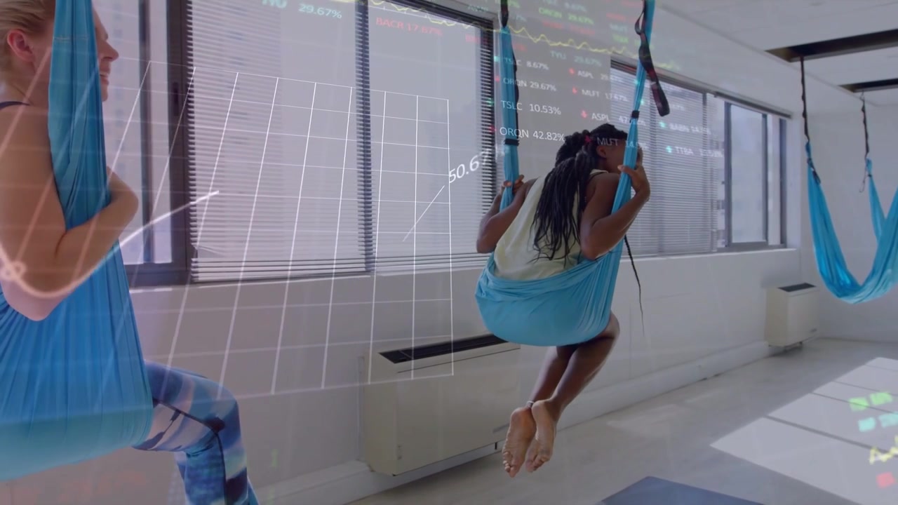Right woman pushing off mat, pulling hammock, lifting for yoga as transparent HUD overlaying scene