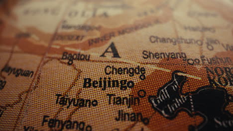 close-up of a vintage world map focusing on china