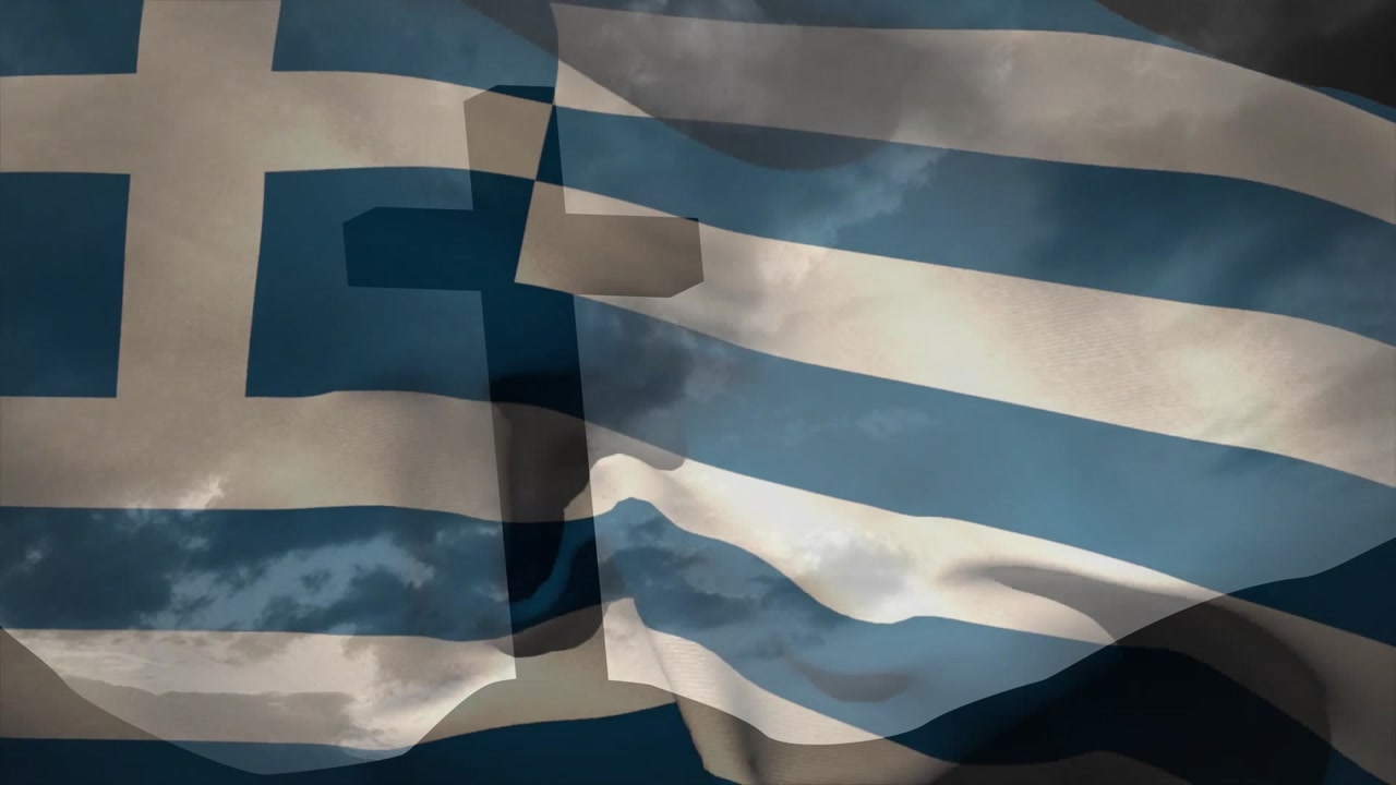 Wind gusts initiating Greek flag rippling and billowing across frame, revealing cross silhouette