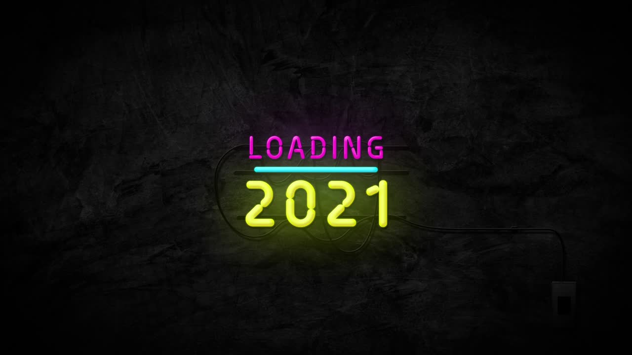 Loading 2021 neon sign on stone wall background. Happy new year and holiday celebration concept.