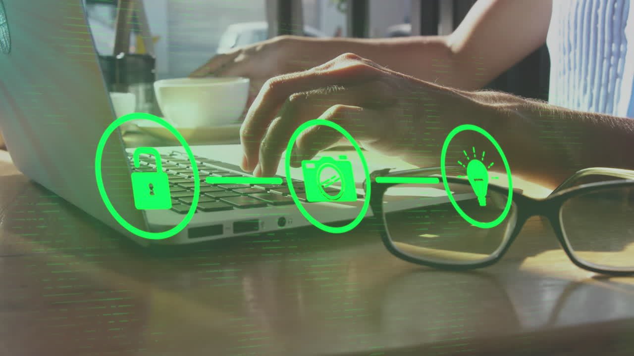 animación de iconos conectados, manos recortadas de una mujer caucásica trabajando en una computadora portátil y bebiendo café