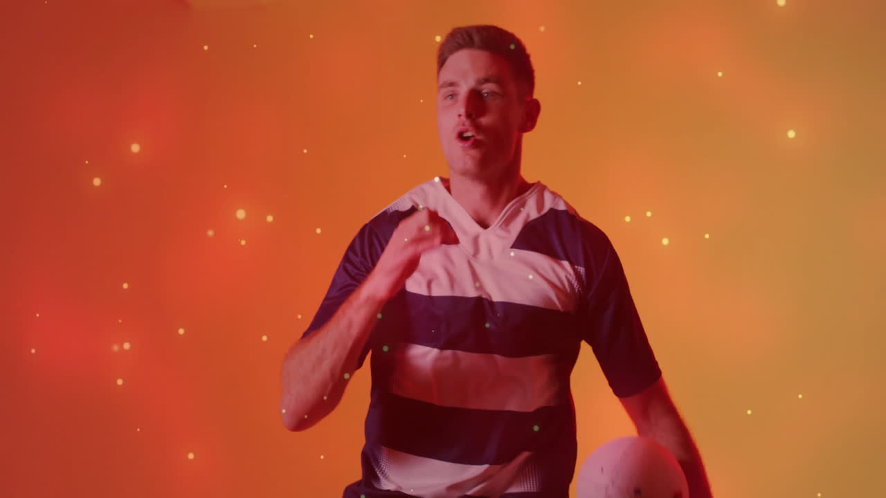 공을 들고 있는 백인 남성 럭비 선수 위에 반이는 불빛의 애니메이션