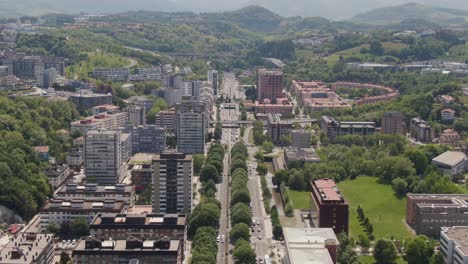 cityscape and street traffic of san sebastian city, aerial drone view