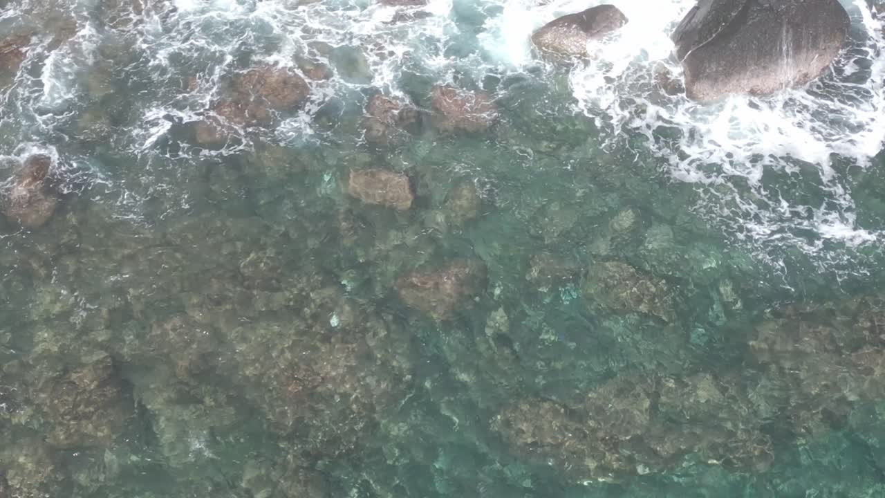 Mauritius - Albion - slow top down panoramic on the rocks in front of the lighthouse