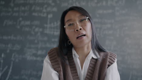 asian female teacher in classroom
