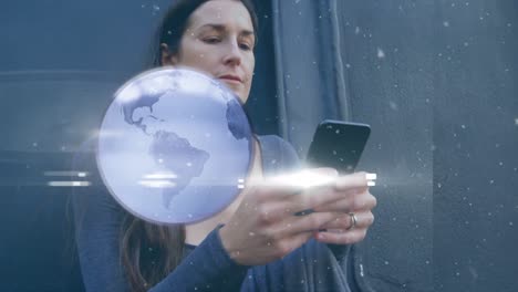 Animation-of-globe-and-lights-over-smiling-caucasian-woman-using-smartphone