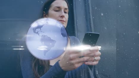 animation of globe and lights over smiling caucasian woman using smartphone