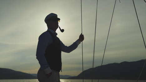 captain on a yacht at sunset