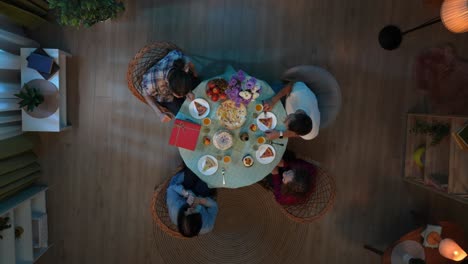 friends celebrating a birthday dinner at home