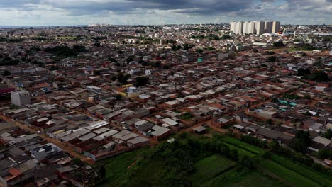 the sol nascente favela below and modern high-rise buildings in the distance - aerial view