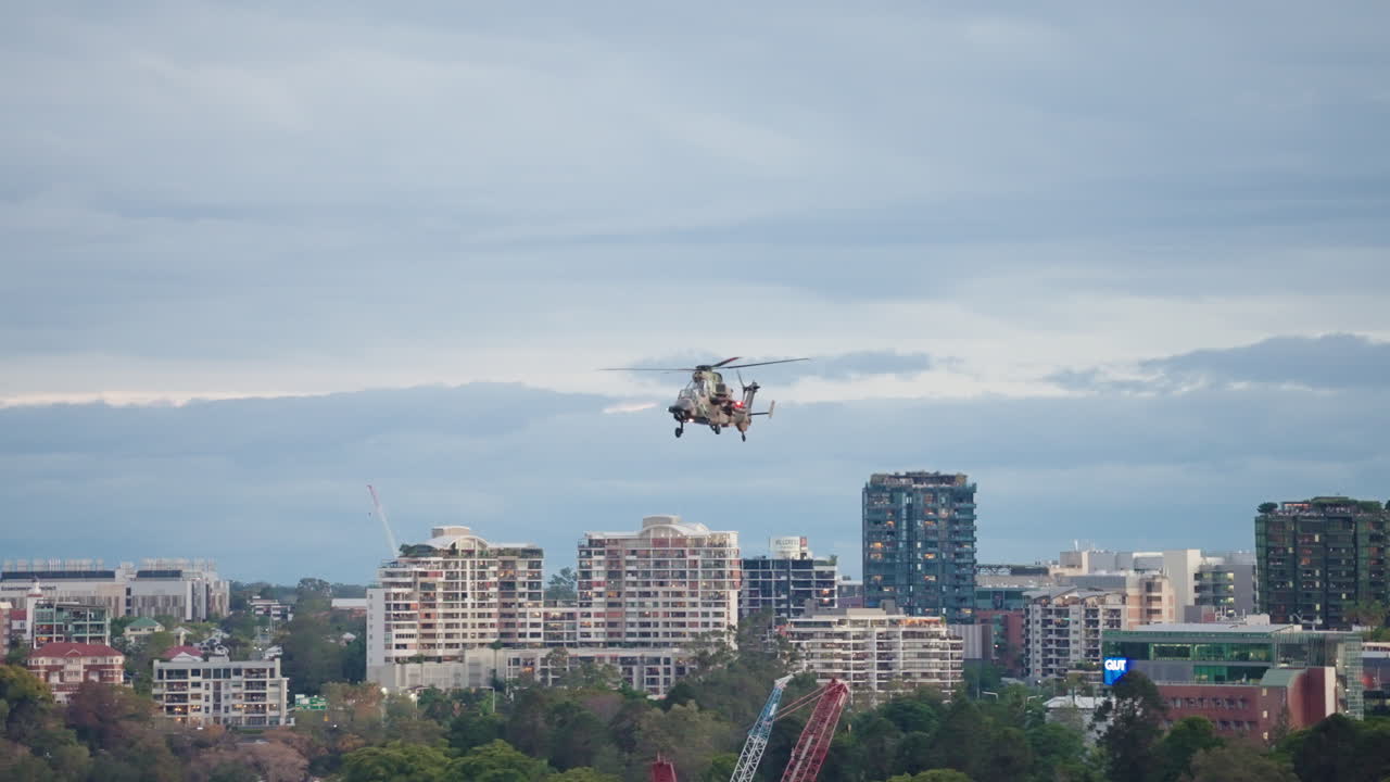 RAAF ARH Military Helicopter Flying Over Brisbane City Buildings During Riverfire, 4K Slow Motion