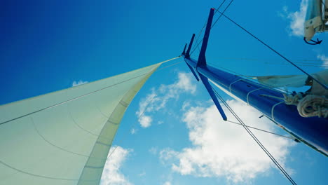 wind sailboat main mast navigating in open sea