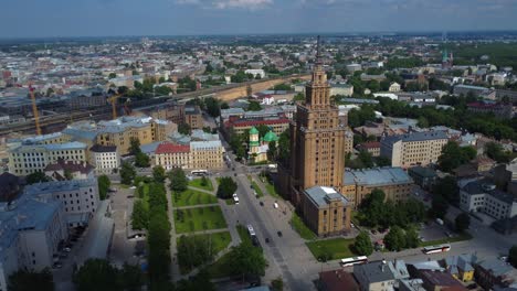 drone flying towards latvian academy of sciences skyscraper in riga, latvia