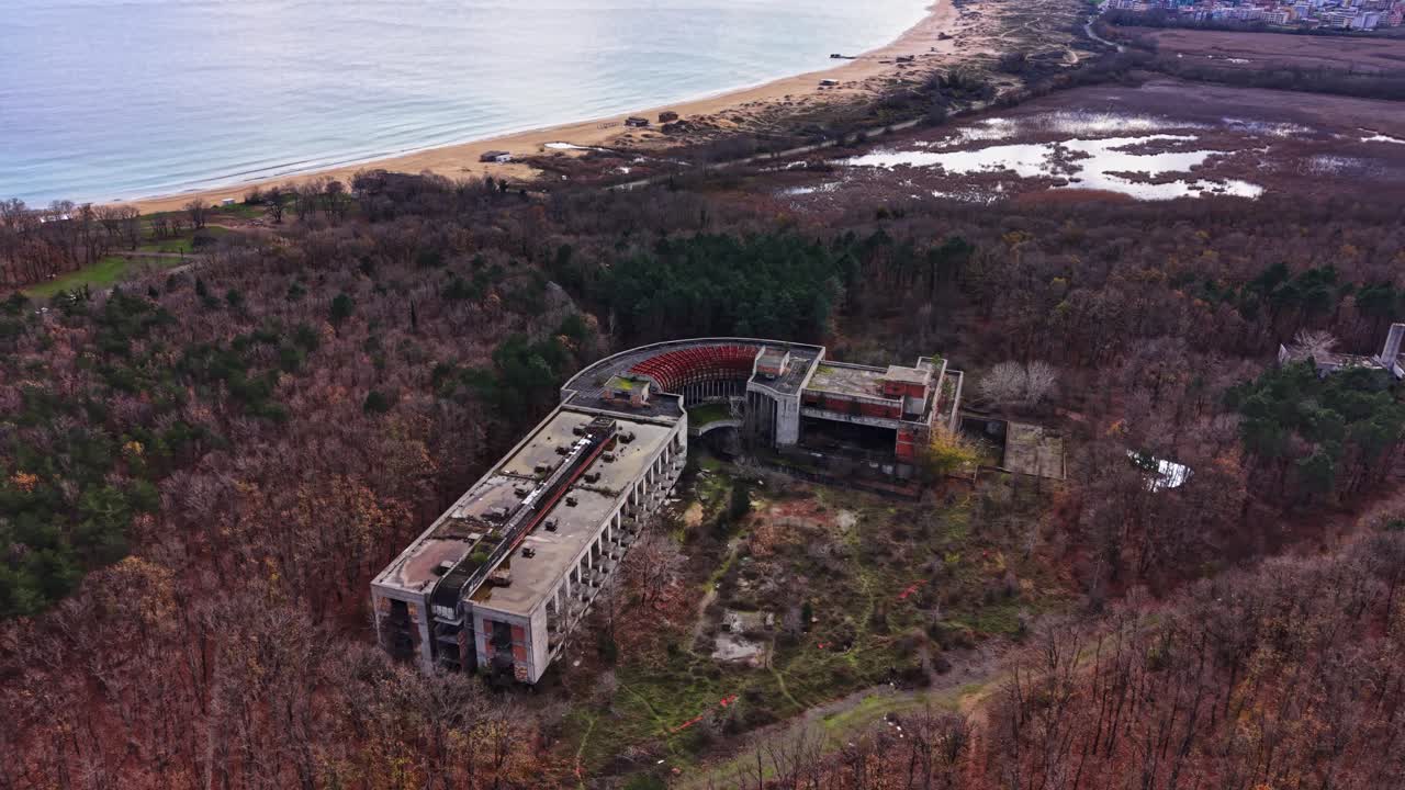 Abandoned coastal resort overlooking the vast ocean and sandy beach