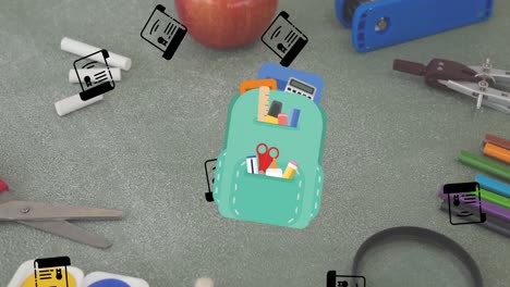 animación de los iconos de los artículos escolares que se mueven sobre los artículos escolares