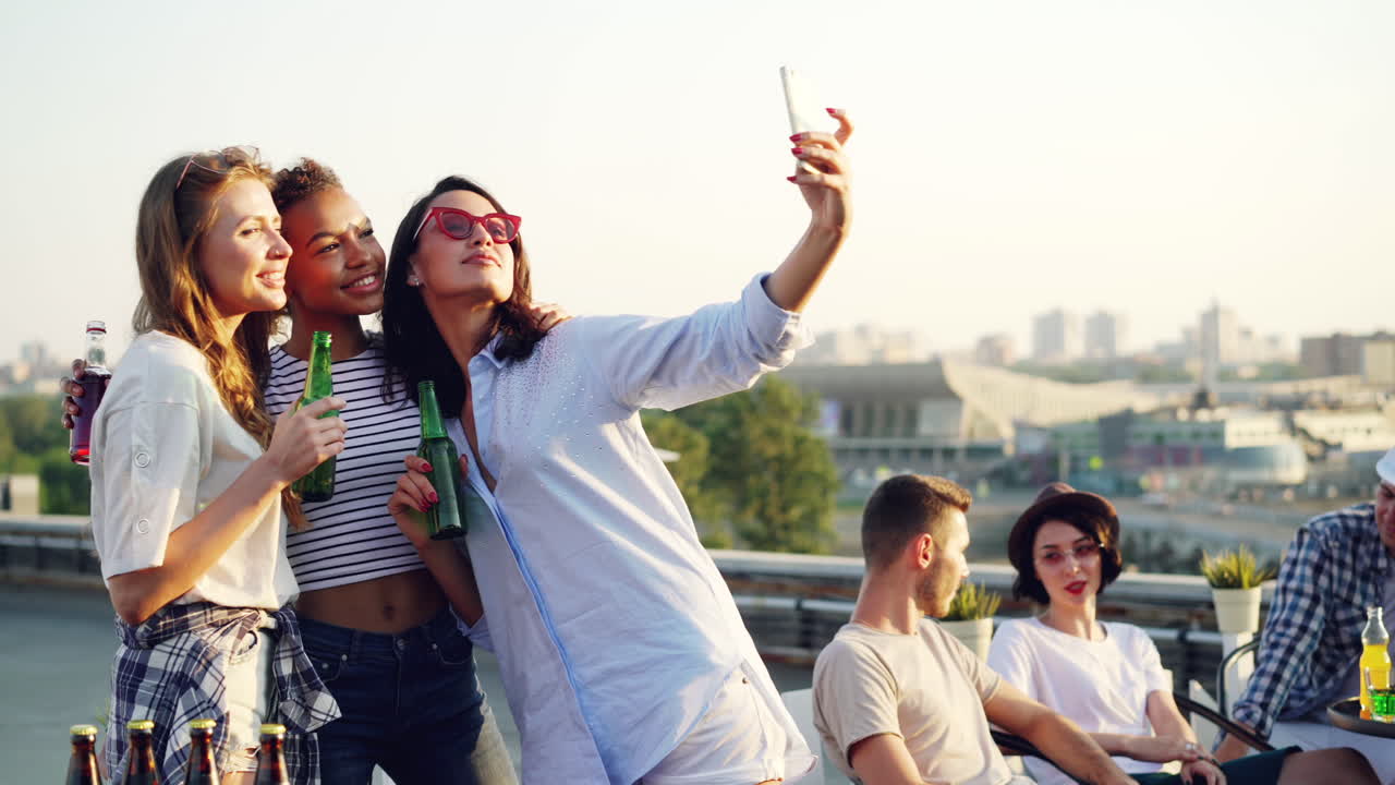 Friends Taking a Selfie on a Rooftop Party