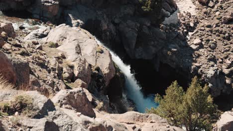 Waterfall-between-rocks-on-a-sunny-day