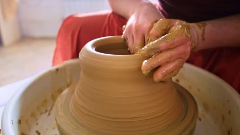 artistry in clay: a skilled pottery session capturing the creation of a beautiful ceramic vessel from beginning to end