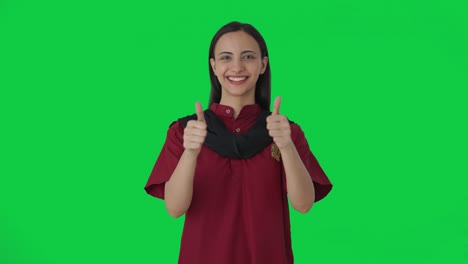 Happy-Indian-female-housekeeper-showing-thumbs-up-Green-screen