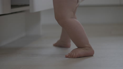 handheld shot of shaky unstable baby feet