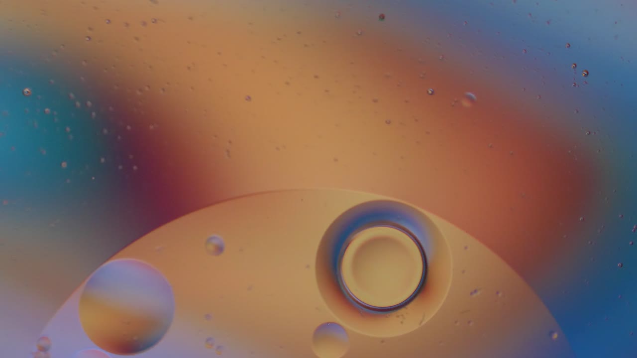 Close up artistic of oil drops in water floating