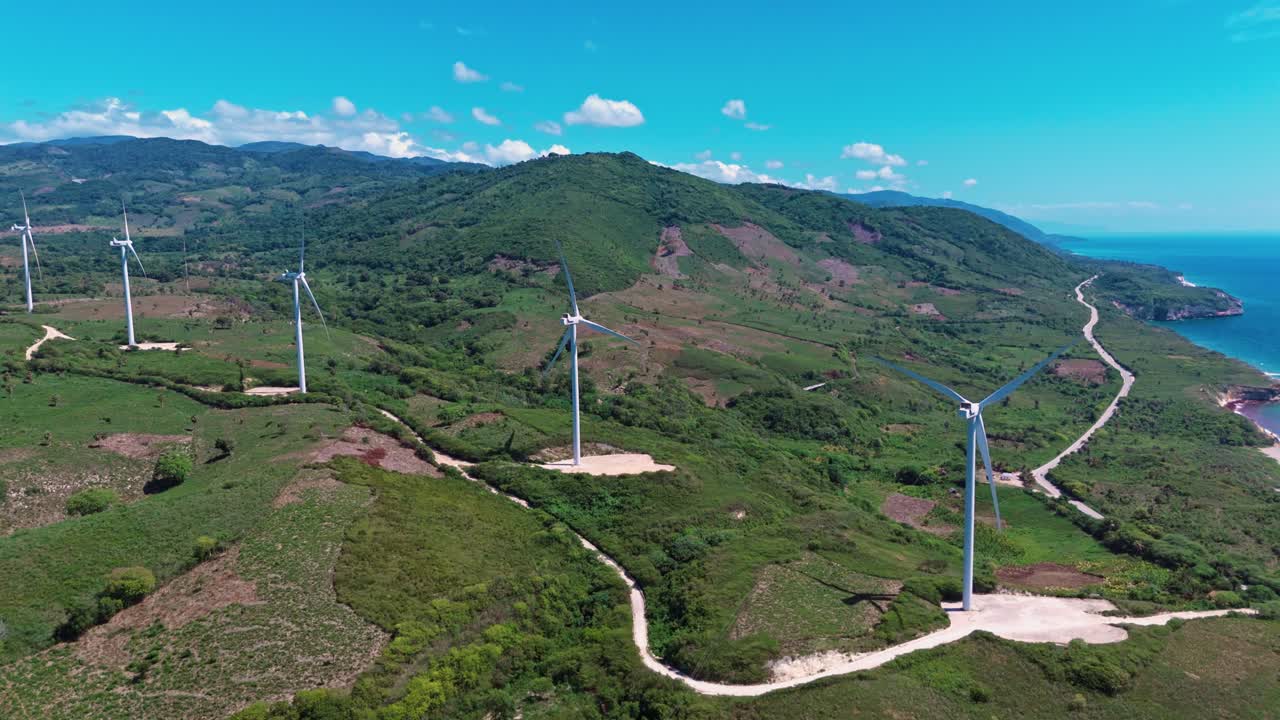 Wind Turbines On The Mountains Generating Electricity In Barahona, Dominican Republic. - aerial shot