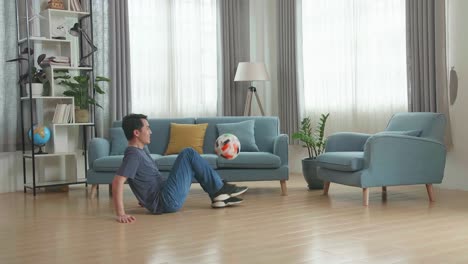 asian man show skill with soccer ball in living room, soccer freestyle