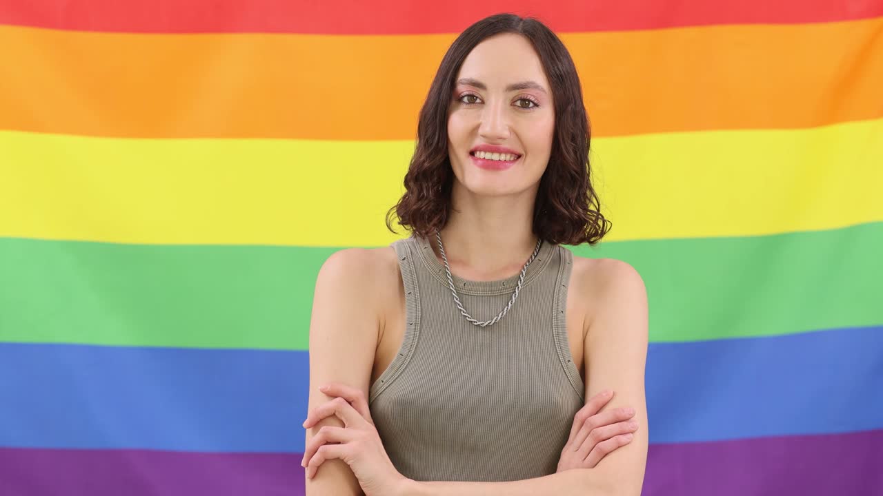 Woman posing with LGBTQ Pride Flag