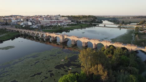 badajoz's puente de palmas bridge and guadiana river, stunning aerial vista of golden spanish landscape