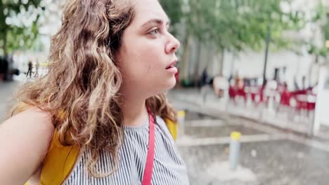 vlogger woman observing city scenes during athens summer walk