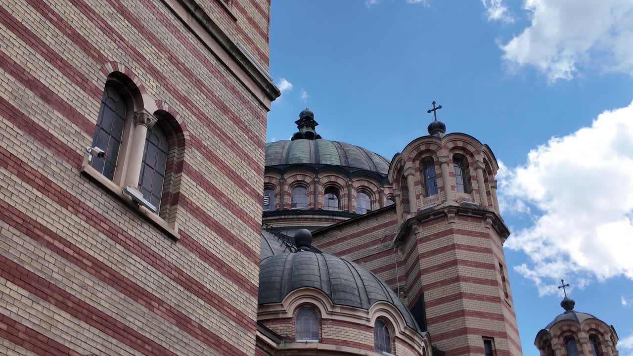 Close-up footage capturing the ornate domes of the Holy Trinity Orthodox Cathedral in Sibiu, showcasing intricate architectural details