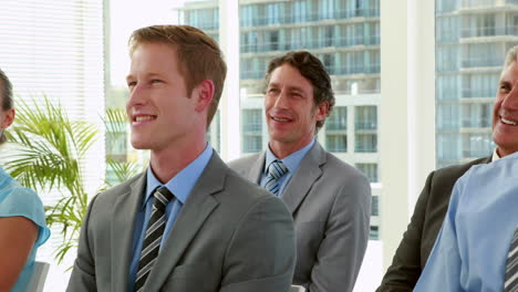 Business-people-smiling-during-conference