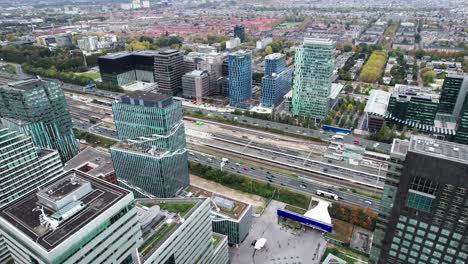 bird's aerial view of amsterdam zuid business banking district, pan, day