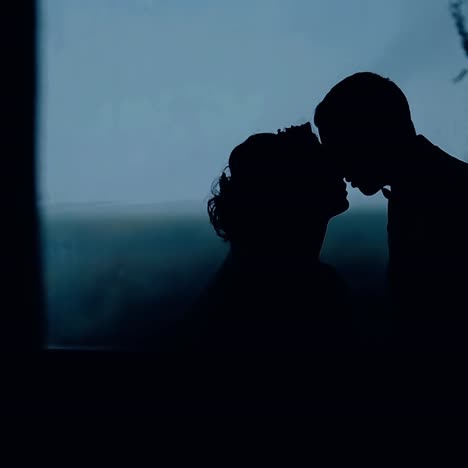 silhouette of wedding kiss