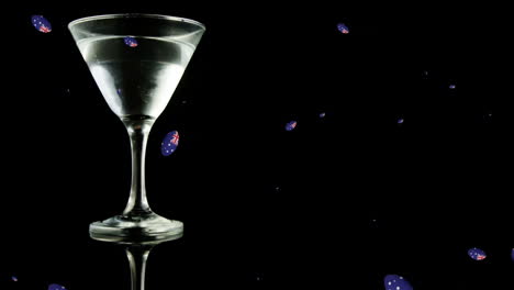 animación de bolas con bandera australiana cayendo sobre un vaso de martini sobre un fondo negro