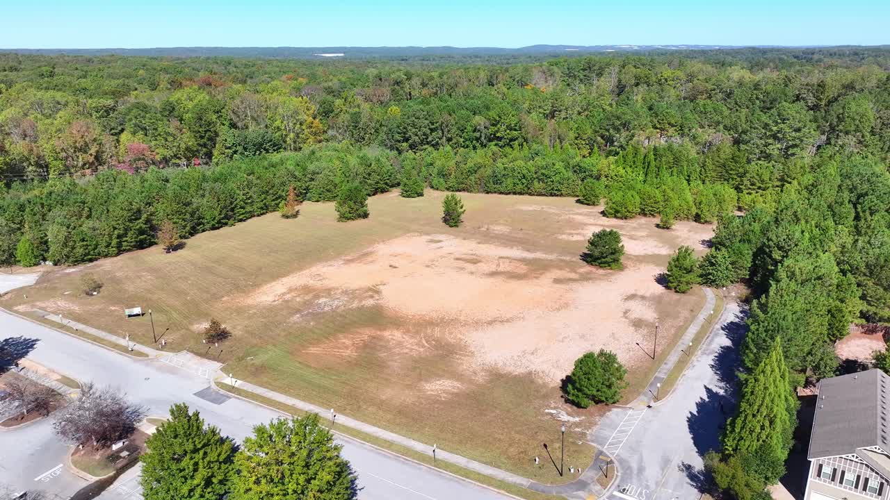 Aerial of housing development land surrounded by wooded park, Butner road, Springbox Dr, Fairburn, Atlanta, Georgia, Aerial
