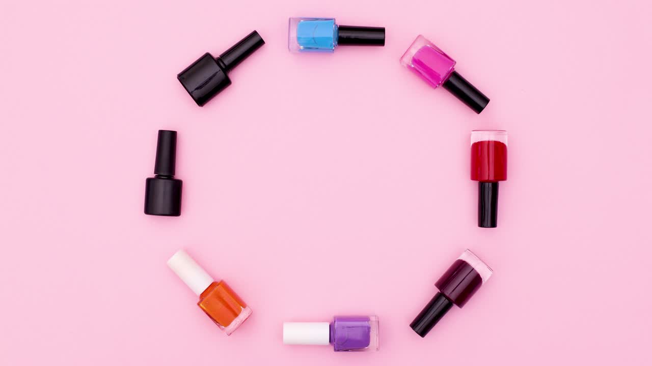 Black nail polish bottles change into colored bottles. Stop motion