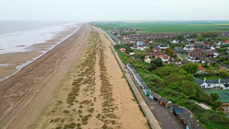 aerial footage brings mablethorpe to life, highlighting beach huts, sandy beaches, amusement parks, rides, and the joyful tourist atmosphere