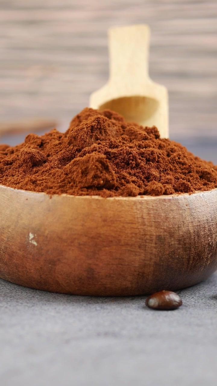 Ground Coffee Powder in a Wooden Bowl