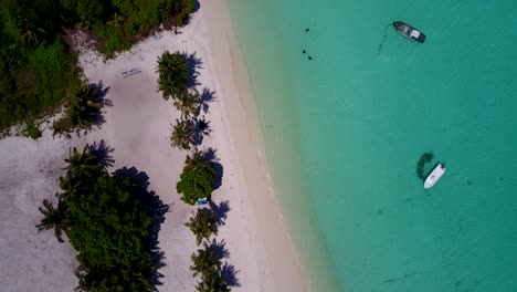 aerial shot straight from above drifting along tropical beach of thailand