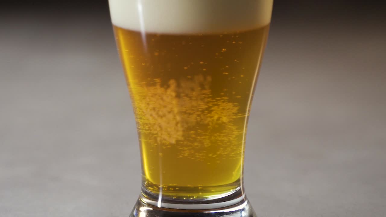 IPA style beer in pint glass from bottom to top.