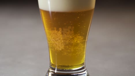 ipa style beer in pint glass from bottom to top.