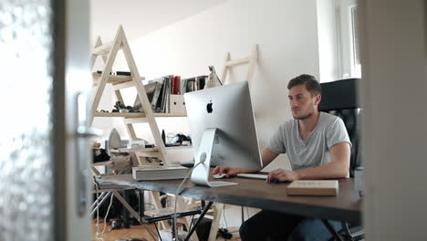 man working at his home office