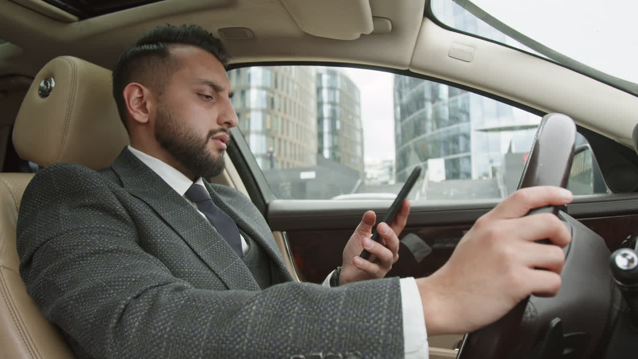 Driver in Suit Talking on Smartphone